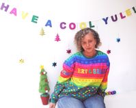 Our vibrant and festive Rainbow Christmas Sweatshirt is the perfect addition to your holiday wardrobe!  Embrace the spirit of the season with this unique and eye-catching sweatshirt that combines the coziness of a classic sweatshirt with a burst of colour and Christmas cheer. 🌈 This Christmas rainbow pattern is a delightful twist on traditional holiday colours. It brings a sense of joy and inclusivity to your Christmas celebrations. Whether you're attending a holiday party or curling up by the fire, this sweatshirt will make you feel like a ray of sunshine on a winter's day. The sweatshirt features a beautifully printed rainbow pattern, with hearts, stars, peace signs, trees and snowflakes, surrounding the words 'Merry & Bright' in a rainbow of colours and retro hippie style font. It's a