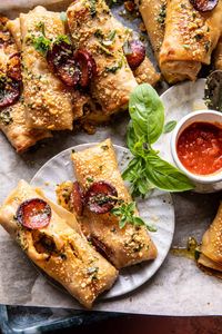 Garlic Butter Pizza Egg Rolls: Cheesy and delicious! Serve with garlic butter and marinara sauce...perfect for game day and the holidays too!