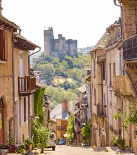 southwest France town called Najac with a castle in the distance