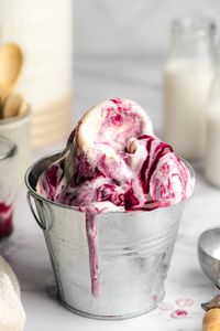 This dairy-free frozen yogurt has a delicious homemade berry coulis swirl and uses just 3 base ingredients. Perfect for cooling down this summer!