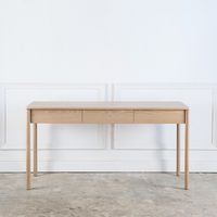 The Franc Desk is hand-crafted in solid wood on sturdy spindle legs, featuring either two or three soft close drawers and the option to add cable ways.