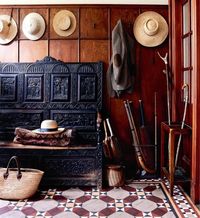 Hall way. Antique furniture. Heavy carved oak bench. Deep, warm colours.