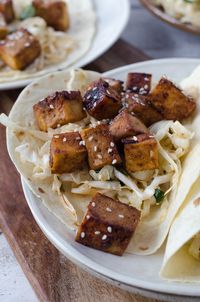 Korean Tofu Tacos! Crispy, Spicy tofu with a refreshing, cooling slaw. Must try this vegan dinner recipe! | www.delishknowledge.com