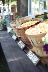 Add a popcorn bar to an outdoor wedding.