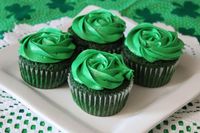 Choose from our classic vanilla cake dyed green of course or our decadent chocolate stout cupcake both flavors are topped with our home made buttercream frosting.