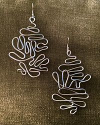 handmade aluminum earrings, each slightly varies in style and shape.