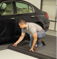 Garage mat w/a patented 2-layer design that absorbs water, snow, & mud. Permeable surface sponges up outdoor muck from car tires & shoes, preventing water & dirt from being tracked indoors. Slip-resistant bottom keeps mat securely in place & its waterproof PVC backing protects a garage floor from unwanted moisture. Polyester top of mat is stain-resistant. Cleans easily w/a vacuum, hose, or power washer. Charcoal gray. Large Mat. 240" L x 88" W $199.95