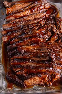 This Oven Roasted Brisket is coated with a smoky spice rub and cooked low and slow with BBQ sauce until exceptionally tender. It's delicious served with classic side dishes or piled on sandwich rolls.