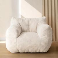 Indulge in the luxurious softness and coziness of the beige teddy fabric used in our bean bag chair. Not only does it have a delicate touch, but it also provides warmth and breathability. With convenient built-in pockets, you'll have plenty of extra storage space. Experience comfort like never before! Dimension: 37"W x 35"D x 31"H. Fabric: Soft Teddy Fabric Filling: High-density foam, which helps retain shape and provides excellent support NOTE: In order to follow the concept of environmental pr