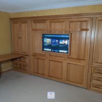 Golden Stain on Maple with Crown Molding, Raised Panels. 7" Shelf Leg. LED Light Kit. 2 USB Plugs Inside Bed Cabinet. 7-Port USB 2.0 Hub Strip, 7 Receptacle with 2 USB. LED 4k UHD Smart TV Mounted on Front of Wall Bed. Custom TV Frame. Left Cabinet: Bottom File Drawers, Doors Above. Customized Fold Down Desk Behind Doors.  Trim Allows Doors to Close if Desk is Down. Pop-Up Outlet: 1 USB, 1 Plug for Cabinet. Right Cabinet: Bottom Drawers, Doors Above w Adjustable Shelves. Snack Tray for Cabinet.