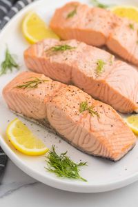 Tender, flakey, moist salmon cooked low and slow in an aromatic poaching liquid making this tasty poached fish ready in just 15 minutes!