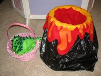 Use felt, beans, googly eyes, a trash can, a garbage bag, and a glue gun, make a bean bag toss game for a dinosaur birthday party!