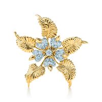 Jean Schlumberger’s visionary creations are among the world’s most intricate designs. Ornate and elegant, this clip is the perfect finishing touch to any look. 18k gold and platinum with round brilliant diamonds; Carat total weight .93 | Tiffany & Co. Schlumberger® Floral Leaves Clip in 18K Gold with Diamonds