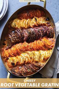 This beautiful Cheesy Root Vegetable Gratin is as beautiful as it is tasty. Sweet Potatoes, beets, and parsnips with cream and garlic baked to perfection. We love this side dish for special occasions like Thanksgiving. #gratin #vegetable #sidedish #recipe