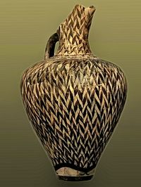 Ewer w/reed type decoration that creates a pattern of dark and light colors on the surface of the pot. 1450 BC, Heraklion Museum