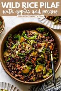 Wild Rice Pilaf with Brussels sprouts, apple, toasted pecans, and dried cranberries. This holiday-worthy side dish is easy enough for weeknight cooking and sure to impress. Serve alongside your protein of choice, such as roasted chicken or turkey, for a flavorful, filling meal. via @https://www.pinterest.com/jamievespa/