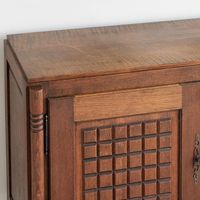 Incredible wood sideboard by Charles Dudouyt from France, 1940's. Beautiful carved wood square detail on cabinet doors with three carved center drawers and chunky block legs. Cabinet doors on each end open to a single shelf for storage. Original dark wood finish shows nice grain in wood with age and patina. Includes 2 original keys. Beautiful and functional piece.