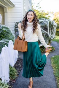 Styling a Maxi Skirt for Fall is Easy - One way to wear a silk maxi skirt in the fall is with a sweater tucked into it. Paired with a knot headband, camel booties, and camel purse - by Caitlin Houston Blog #fallfashion #fallmaxiskirt