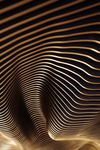 This undulating ceiling installation is composed of laser cut MDF fins with a black finish. #SculpturalCeiling #CeilingInstallation #Sculpture #RestaurantDesign