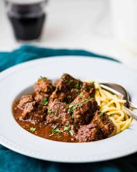 This easy German goulash is a rich beef stew seasoned with paprika, caraway, and onion. Serve the goulash recipe with spaetzle or egg noodles, even potatoes. This classic German dish is always a hit.