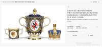 A ROYAL CROWN DERBY TWO-HANDLED BLUE-GROUND ARMORIAL COMMEMORATIVE CUP AND COVER 1981, RED PRINTED MARKS, NUMBER 2 OF AN EDITION OF 200 With The Prince of Wales' crest and Lady Diana Spencer's coat-of-arms, the foot with the gilt inscription 'ST. PAUL'S CATHEDRAL 29th JULY 1981', the cover with a gilt inscription 'THE MARRIAGE OF H.R.H. THE PRINCE OF WALES AND LADY DIANA SPENCER'; together with a Royal Crown Derby two-handled blue-ground commemorative cup with a gilt profile portrait of Lady Tha