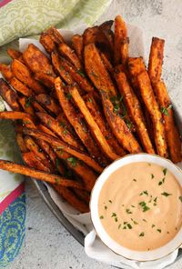 Crispy Baked Sweet Potato Fries are roasted in the oven for a mess free snack or side dish perfect for dipping in your favorite sauce.