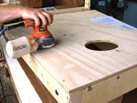 How to Build a Regulation Cornhole Set: Sand the entire board and around all edges including inside the circle. Putty all screw holes. From DIYnetwork.com