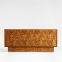 Prized for its fascinating array of whorls and knots, burl wood brings the drama to our stunning Ambrose dresser. Broad planes, flat-front drawers and a pronounced plinth base showcase the unique markings while creating a striking minimalist silhouette. Small knob pulls accent the six drawers with hand-forged texture and the warm glow of burnished brass. A statement-maker on its own, the dresser amps up the impact when paired with our coordinating Ambrose canopy bed and nightstand.   • FSCr-cert