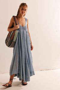 Effortlessly ethereal, this breezy maxi from our free-est collection will turn heads all season long. **Fit:** Billowy, trapeze-style silhouette **Features:** Scoop neckline, pleating and crochet lace trimming throughout, dropped armholes, back tie detailing **Why We ❤ It:** Stunning with strappy heels or easy with beachy sandals, this style has endless ways to wear. | Coastal Core Maxi Dress by free-est at Free People in Blue, Size: L