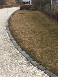 Belgium block driveway edging with structural turf overflow parking area