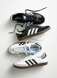 - adidas Originals at Simons- Introduced in 1950, the legendary Samba was developed for soccer training on frozen ground. Although it has evolved over the decades, its fundamentals remain the same: every step is cushioned by the foam midsole, well-gripped thanks to the gum sole, and adorned with the three signature serrated stripes. Equally at home on the court or the street, this iconic sneaker has become a stone-cold classic.- Full grain leather upper with suede overlays- T-toe reinforcement for better support and abrasion resistance- Comfortable textile lining- Leather-lined, lightly padded collar- Removable moulded foam footbed- Embossed EVA midsole- Non-marking gum rubber outsole for excellent grip- Model number: B7580