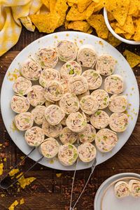 Chicken Pinwheels - A quick and simple party snack that's a real crowd pleaser. Cream cheese, chicken and all the fixins' are wrapped into a flour tortilla to make delicious roll ups. 