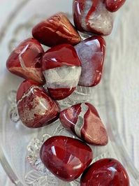 ✨ Red Jasper: Your Earthly Anchor of Courage and Calm! ✨ These mesmerizing stones are more than just a pretty addition; they are grounding, calming, and a source of unwavering courage and strength. Let Red Jasper be your earthly anchor on this journey of self-discovery. 🌍🌹 Why Choose Red Jasper for Your Crystal Collection: 🌹 Earthy Elegance: Red Jasper is a stunning testament to the beauty of the Earth. Each tumbled stone boasts unique patterns, showcasing the wonders of nature in every piece