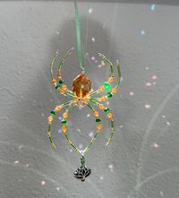 Tinsel the Christmas spider. Beautiful shiny beaded spider ornament comes with the story of Tinsel the Christmas spider. Wonderful keepsake for a child or a grown up. The size of your spider depends on the size of the beads I used, but most of them range from 2-4 inches long and 1.5 to 3 inches wide. Your size may be slightly different. Your spider will arrive in a clear, compostable bag.