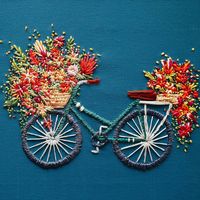 Embroidery Flowers Spill From the Bikes' Baskets in Whimsical Bicycle Art