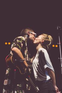 this was the cutest thing to watch 'cuz he kept on kissing her when she was pulling away to go backstage again