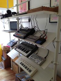 this is my standing studio using ikea stolmen system to rack my synths and drum machines.