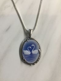 Blue agate swan cameo in a ocean setting