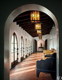 Make it a Loggia!  “I’m eternally seeking out the adventure of discovering the magic of homes in California,” Keaton remarks. Original tiles pave the loggia. “I love contrast,” she says. “I don’t want to be enclosed in darkness, nor do I want to be overwhelmed by too much light.”