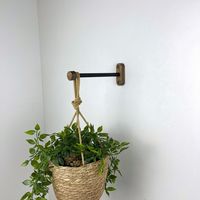 "Add some greenery to your space in a stylish way with the modern wall plant hanger hook. You can use the indoor plant bracket in your living room, bedroom, or office to make your space more attractive. Wood and metal plant hook also makes a great gift for people who love plants and simple decor.  It's easy to install on concrete or brick walls and comes with all the necessary hardware. A 1/4\" (6 mm) drill bit must be used to drill the hole in the wall. The wood wall hooks are available in thre