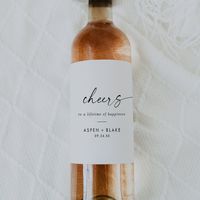 These modern script cheers wedding wine labels are perfect for a minimalist wedding reception. The simple black and white design features unique industrial lettering typography with modern boho style. Customizable in any color. Keep the design minimal and elegant, as is, or personalize it by adding your own graphics and artwork. Personalize the wine bottle stickers with the names and date. These labels can be used for the wedding reception, rehearsal dinner, or simply change the wording to suit