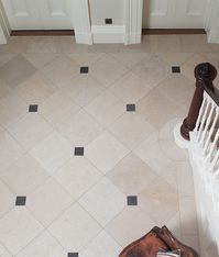 This inky-black European limestone is covered in minute off-white fossils, which are softened in effect by the tumbled finish for a refined Flemish feel. A feature of traditional homes that never ceases to give added drama and refinement to a room, cabochons are small tiles that fit in between larger tiles- octagons, pentagons, or hexagons.