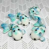 These fish charms were handcrafted using polymer clay and resin. This listing is for one charm. These charms were crafted to be sturdy but should be handled with care. Not recommended for small children. Thanks of looking!