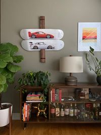 Solid wood art display for skate decks.Size in photos shows a display that holds 5 decks. Size is 33” tall, 3.5” wide, and 2” deep.Easily hangs by a nail or can be securely anchored with pre drilled holes, with no hardware shown on the front for a floating look.Slots are cut to fit a standard skateboard deck, feel free to message me if you plan to hang longboards or other styles, as they may not fit the standard sizes slots, but can be cut to fit them.All items are finished with an all natural h