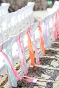 Ribbons on ceremony chairs make for easy and inexpensive decor