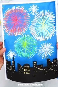 This 3D fireworks art project for New Year is so fun with the crayon and watercolour resist artwork for the backdrop and the 3D city skyline for the foreground. Printable template available. It's a great New Year art project for kids!