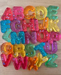 Add our resin alphabet letters into homeschool learning with sensory play, play dough stamping, water play or sight word practice. The possibilities are endless! This listing is for 26 resin letters that are UPPERCASE. Color changing requests are welcomed. Please make a note in the personalization box or send me a message. Please note our letter sets are handmade and color variations and small bubbles may occur. Each set will be sanded before shipping out to their new home. I use high quality resin that is non-toxic and food safe. These are recommended for age 3+ and always use under adult supervision.