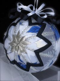 Sparkling Blue Poinsettia Quilted Star Ribbon Ornament by ChristmasGal on Etsy.