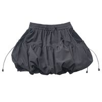 Elevate your wardrobe with our Gray Shirring Elastic Waist Bubble Skirt. This chic and versatile skirt features a flattering shirring elastic waistband that ensures a comfortable and snug fit. The bubble silhouette adds a playful and youthful touch, making it a perfect choice for both casual outings and dressier occasions. The soft gray hue is easy to pair with a variety of tops and accessories, allowing you to create endless stylish looks. Crafted from high-quality materials, this skirt promise