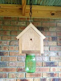 Carpenter Bee Trap made by my neighbor. Do you have a problem with bees boring holes in your wood? Check this out! Bees go in one of the small holes, which are drilled on an angle. They can't figure out how to get out! The mason jar can be removed to dispose of the bees.